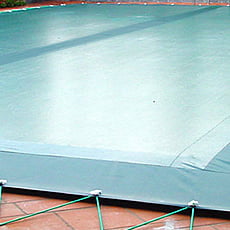 Copertura invernale con fascia filtrante centrale con occhielli e cavo elastico per piscina rettangolare - 400 g/mq